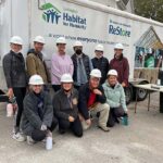 Group photo of Hanna Resource Group team members at a Habitat for Humanity home building project.